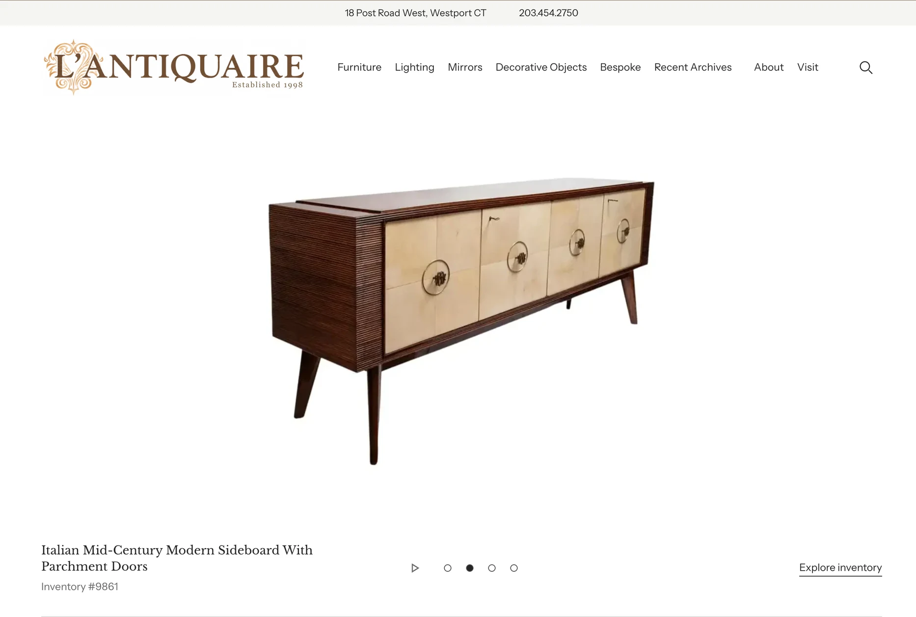 L’Antiquaire homepage with its amber identity and Italian sideboard, designed by AK Design House